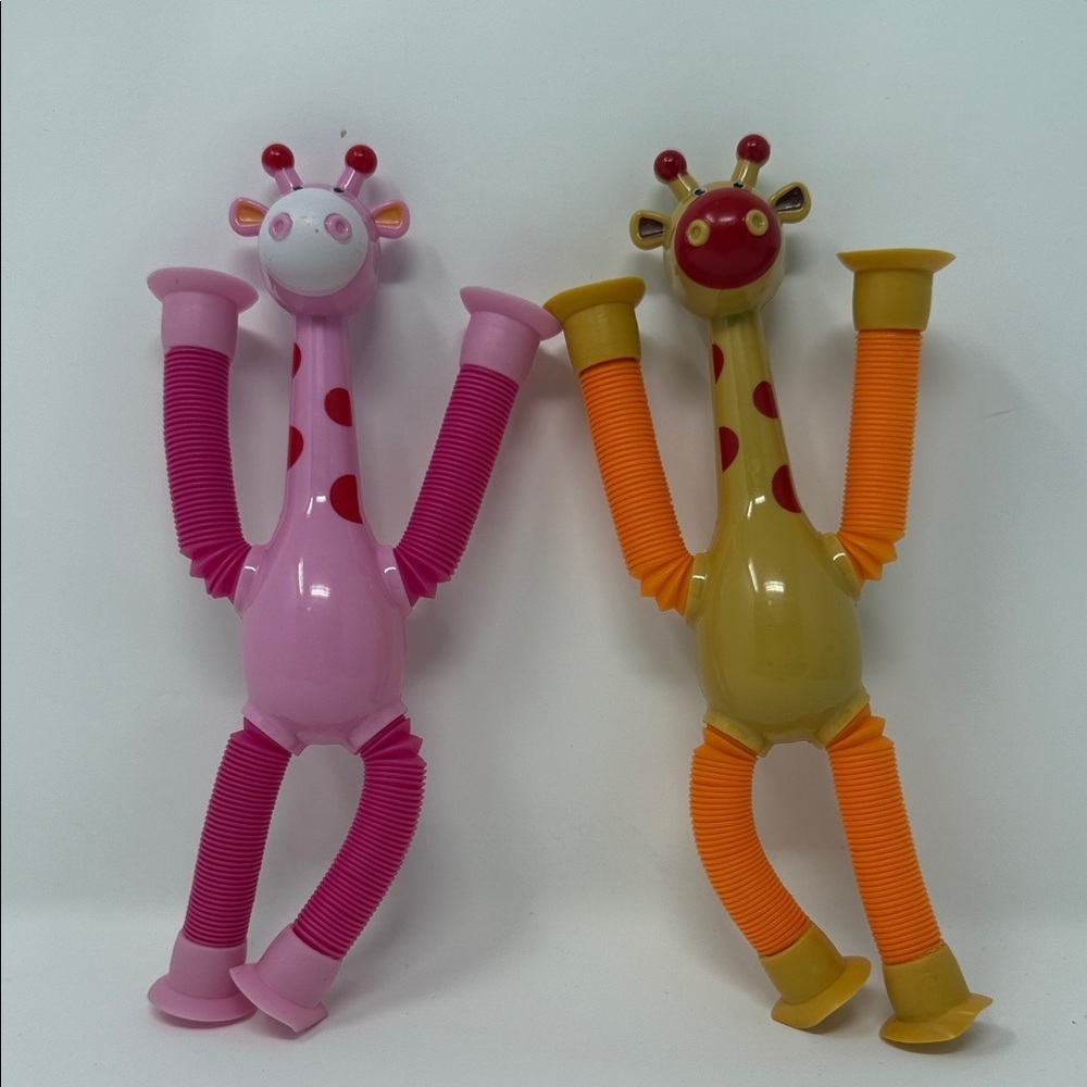 2 Colorful Suction Cup Giraffe Stretch Toys for Kids Pink and Orange NEW No tag